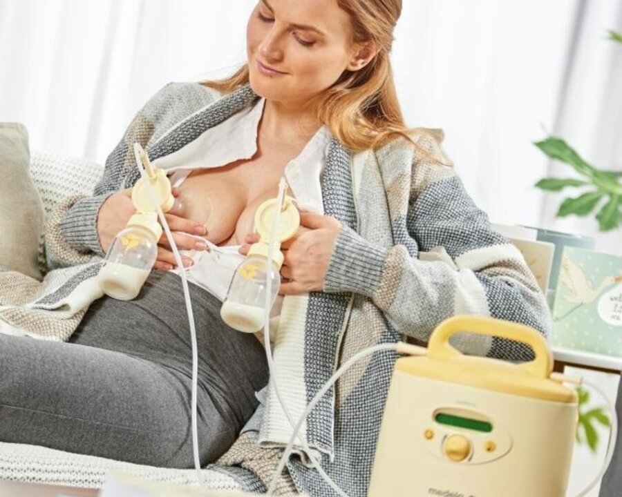 Symphony PLUS® breast pump A mom uses a rental Medela Symphony PLUS® breast pump at home.