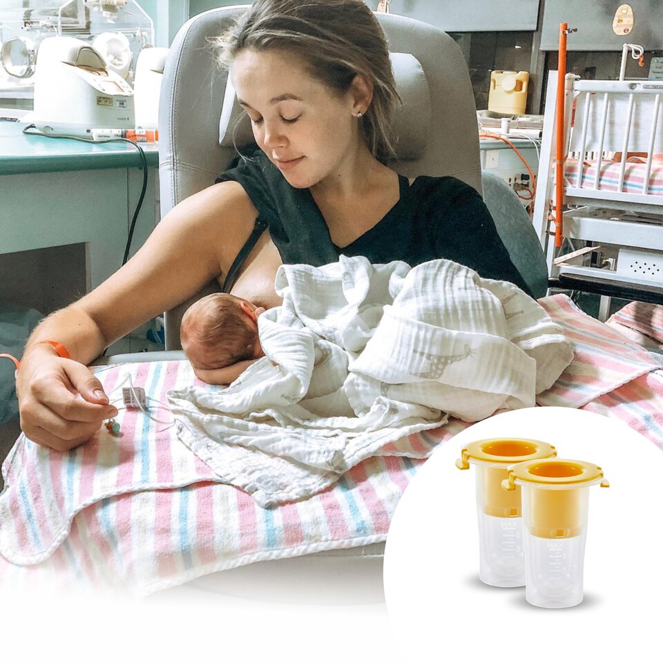 Mom feeding newborn in hospital with Medela Colostrum Protector in foreground