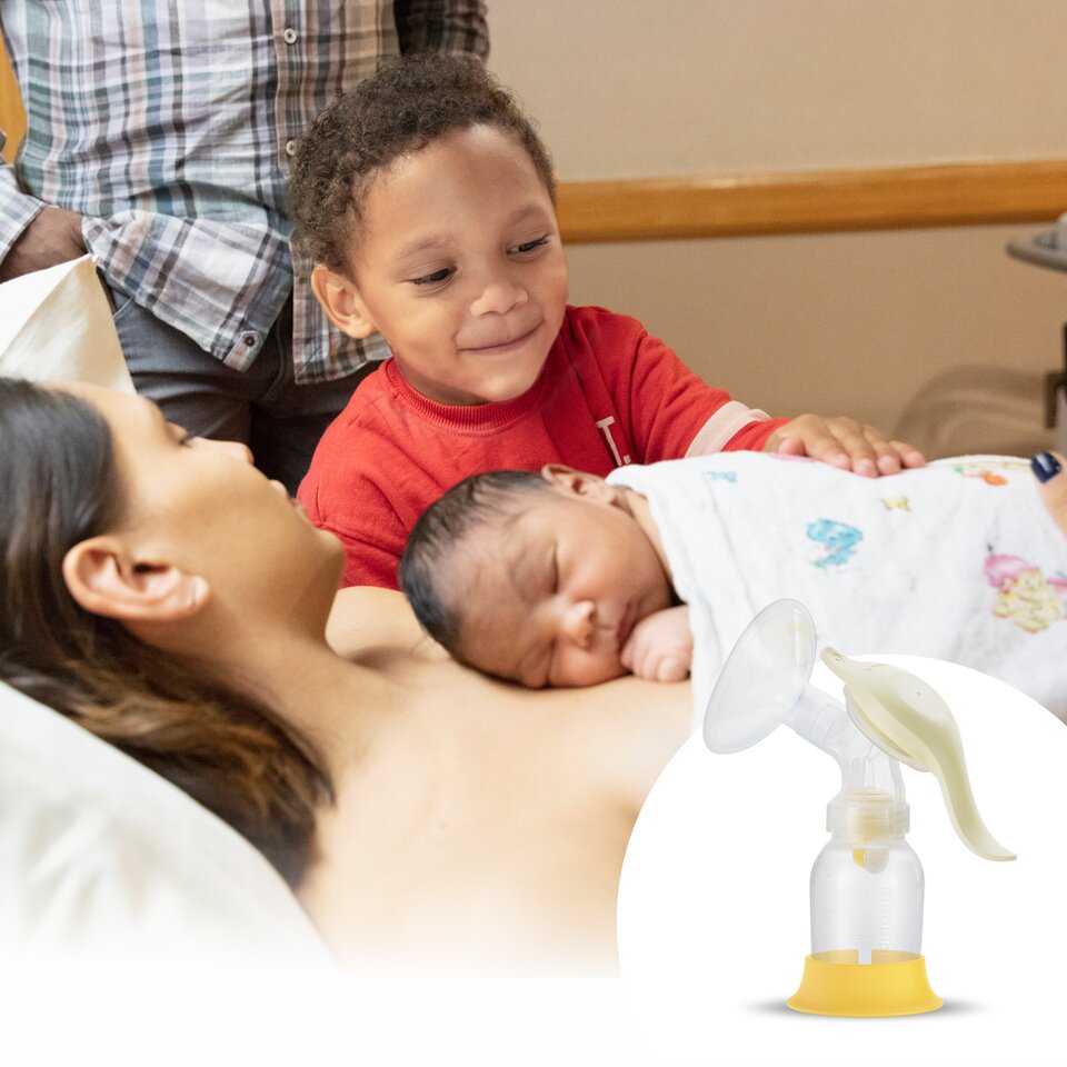 The family gathers in the hospital room after delivery with the Medela Pediatric Set with Harmony® in the foreground