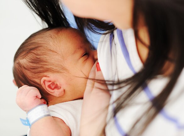Pregnancy Preparation A new mom breastfeeds her newborn.