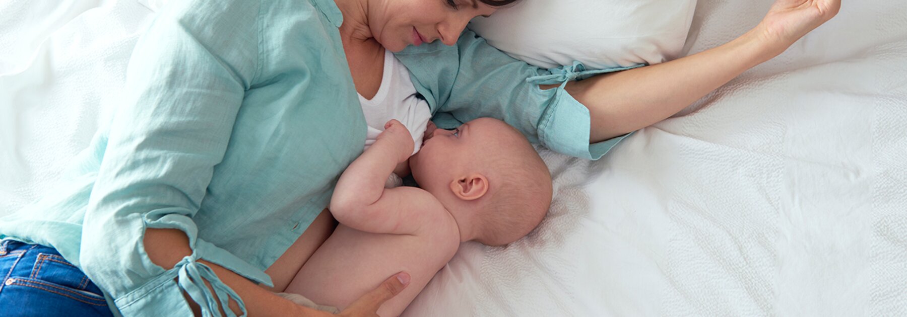 Mother breastfeeding her baby, highlighting the benefits for both mother and child